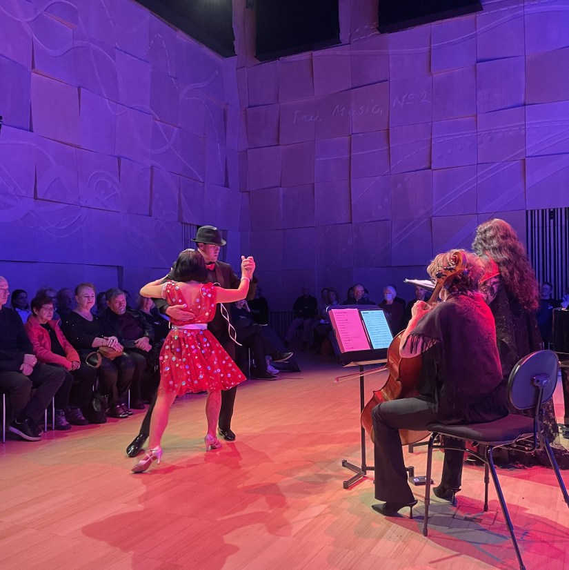 Two tango dancers dance on stage during the concert Art of Tango. 